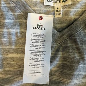 Lacoste boys size 8, gray and white striped T-shirt. New with tags.